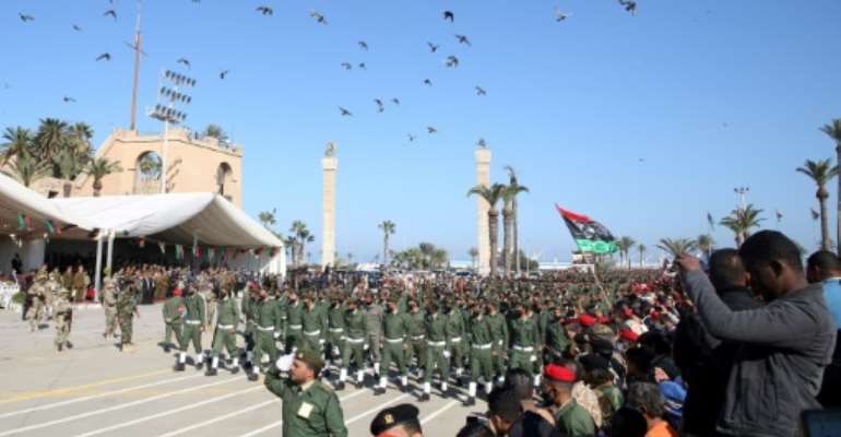 Libyan armed forces parade through the capital Tripoli to mark the country's 69th anniversary of independence. By Mahmud TURKIA (AFP)