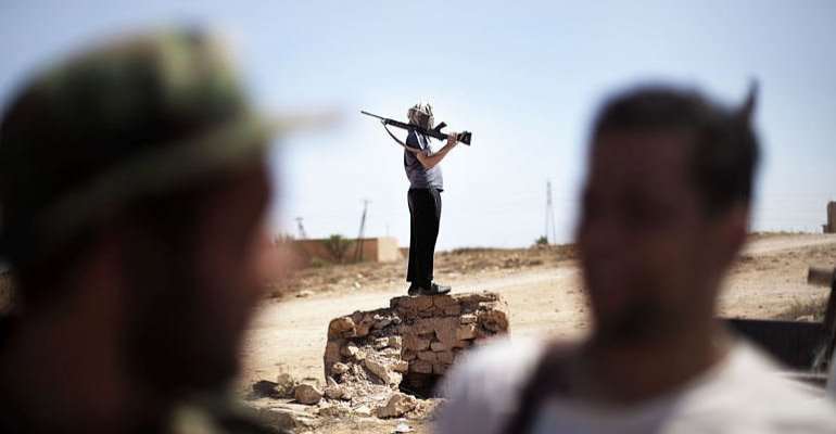 Libyan rebels gather at the front line on the eastern ridge of the Nafusah Mountains. By Marco Longari (AFP)