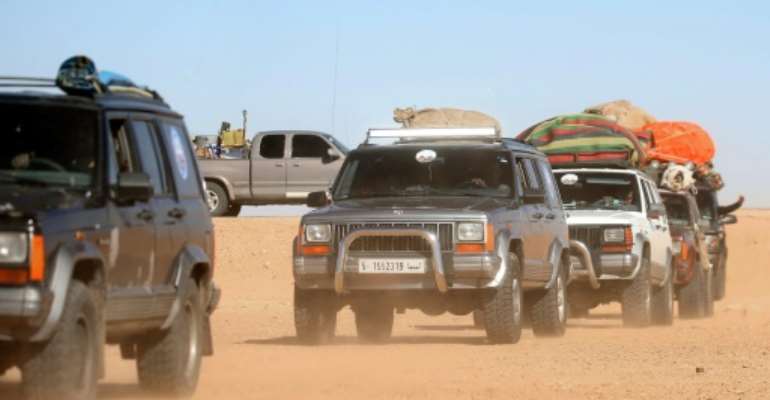 Libyans take part in a 4x4 tourism trip through the desert. By Mahmud TURKIA (AFP)