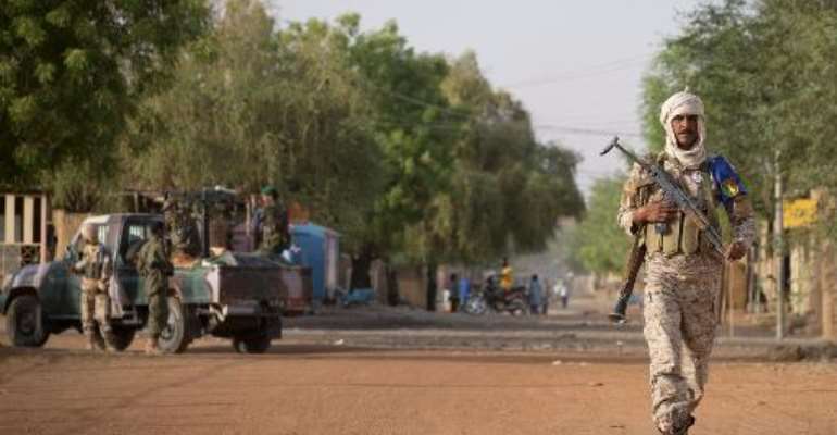A file photo shows a Malian soldier on patrol in Gao, on April 13, 2013. By Joel Saget (AFP/File)