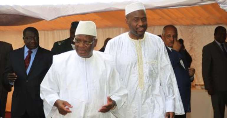 Malian President Ibrahim Boubacar Keita (2nd L) and his new Prime Minister Moussa Mara walk to a cabinet meeting in Bamako on April 16, 2014. By Habibou Kouyate (AFP/File)