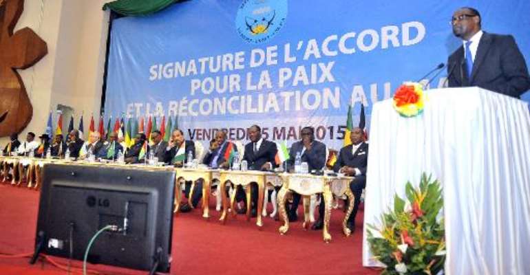 Malian Foreign Affairs Minister Abdoulaye Diop (R) delivers a speech during a ceremony to sign a peace accord between Mali's government and several armed groups on May 15, 2015 in Bamako. By Habibou Kouyate (AFP/File)