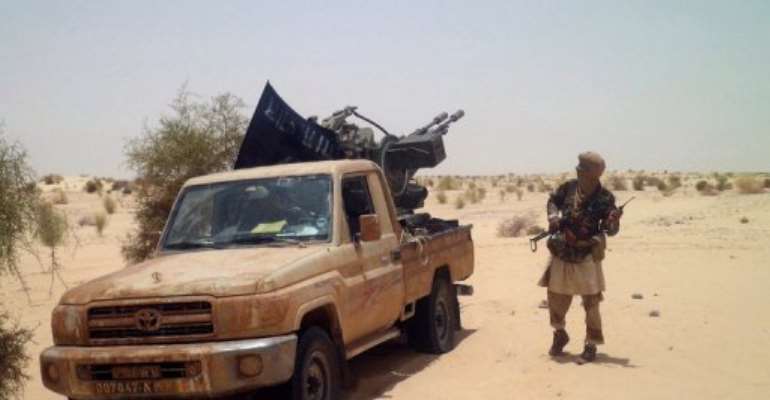 An Islamist rebel of Ansar Dine is pictured in April, near Timbuktu. By Romaric Ollo Hien (AFP/File)