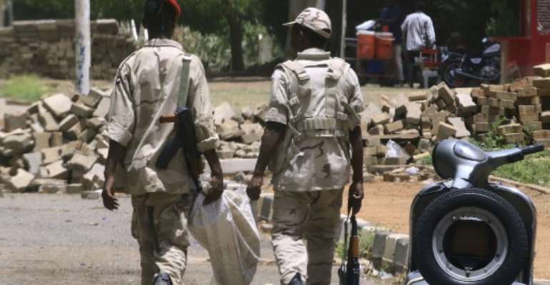 Members of Sudan's paramilitary Rapid Support Forces patrol the capital Khartoum on the second day of a nationwide civil disobedience campaign. By - (AFP)