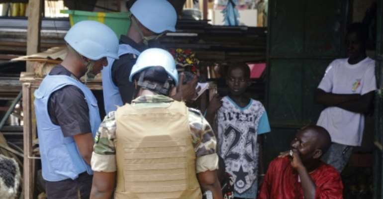 Members of the MINUSMA, the UN peacekeeping force in Mali (pictured July 16, 2018), are looking into allegations of summary executions and forced disappearances, in which the Malian government acknowledges its forces are implicated. By ISMAEL DIALLO (AFP/File)