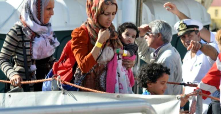 Migrants disembark the rescue ship Aquarius in Italy after being rescued at sea. By Alessandro FUCARINI (AFP/File)