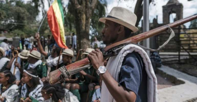 Militiaman Tesfahun Mande strolled through the streets of Gondar yelling chants in praise of Amhara fighters who took on the TPLFÂ . By EDUARDO SOTERAS (AFP)