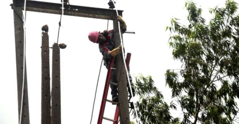 Millions of Nigerians have been hit hard by an economic downturn that is the result of tumbling oil prices. By PIUS UTOMI EKPEI (AFP/File)