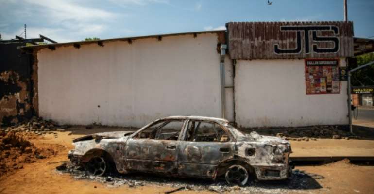 Mobs descended on foreign-owned shops and businesses in Johannesburg's eastern suburb of Malvern late Sunday. By Michele Spatari (AFP)
