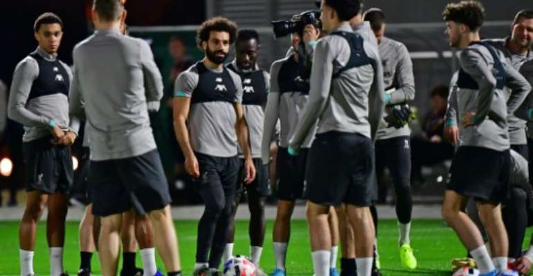 Mohamed Salah (C) at a Liverpool training session in Doha ahead of the FIFA Club World Cup. By Giuseppe CACACE (AFP)