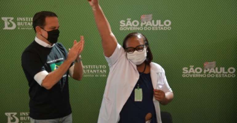 Monica Calazans, a 54-year-old nurse in Sao Paulo became the first person in Brazil to receive the Chinese CoronaVac jab after two vaccines were approved. By NELSON ALMEIDA (AFP)