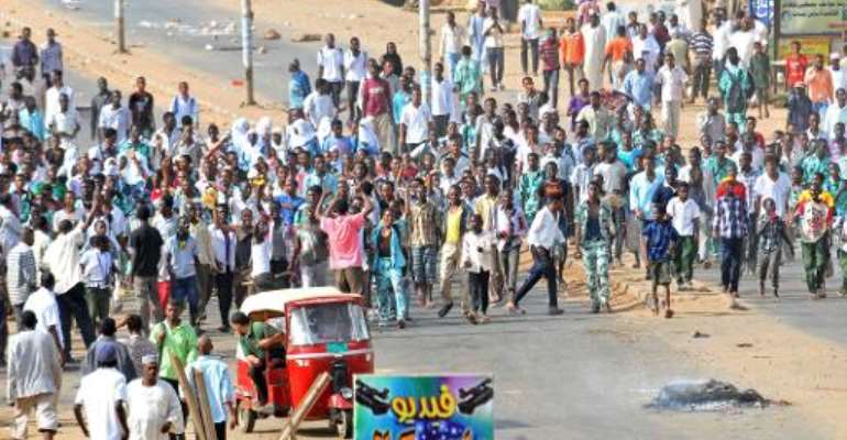 Sudanese protestors demonstrate in Khartoum's twin city of Omdurman after the government announced steep price rises for petroleum products, on September 25, 2013. By (AFP/File)
