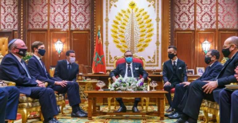 Morocco's King Mohammed VI (center) meets in December 2020 with a US delegation led by Jared Kushner, President Donald Trump's son-in-law and advisor who had encouraged Morocco to normalize relations with Israel. By - (Moroccan Royal Palace/AFP/File)