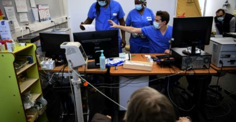 Most countries hope to ease their virus rules for Christmas and New Year. By Christophe ARCHAMBAULT (AFP)