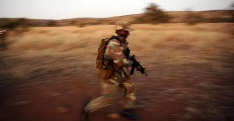 A soldier participates in an exercise against rhino poachers in Kruger National Park in 2011. By Stephane de Sakutin (AFP/File)