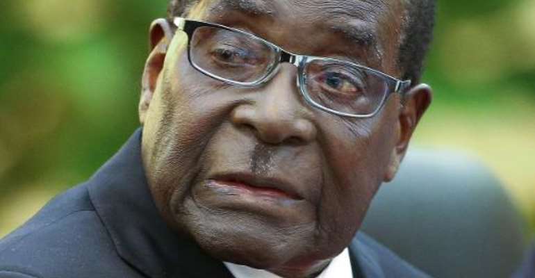 Zimbabwe's President Robert Mugabe takes part in meetings in Beijing on August 26, 2014. By Diego Azubel (Pool/AFP/File)