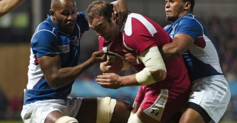 Namibia scrum-half Eugene Jantjies (R) playing against Georgia in the 2015 Rugby World Cup in England. By DAMIEN MEYER (AFP)