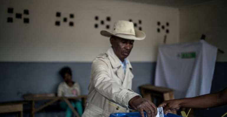 Nearly 10 million voters are eligible to cast ballots for one of 36 candidates. By Marco LONGARI (AFP)
