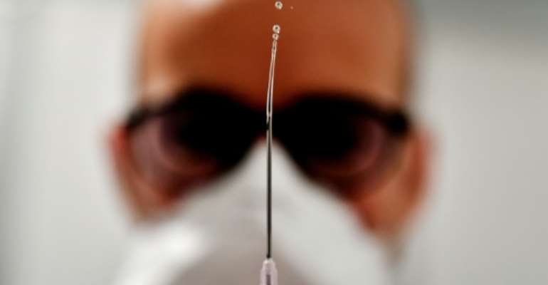 New variants of the virus have raised questions about vaccine effectiveness. By GEORGES GOBET (AFP/File)