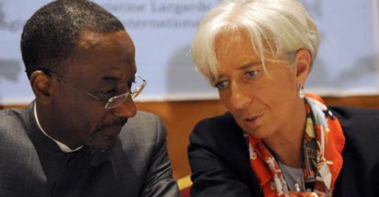 IMF Managing Director Christine Lagarde (right) talks with Lamido Sanusi at a meeting in Lagos on December 20, 2011. By Pius Utomi Ekpei (AFP)