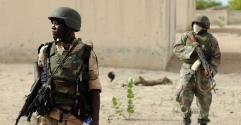 Nigerian soldiers patrol near Maiduguri on June 5, 2013. By Quentin Leboucher (AFP)