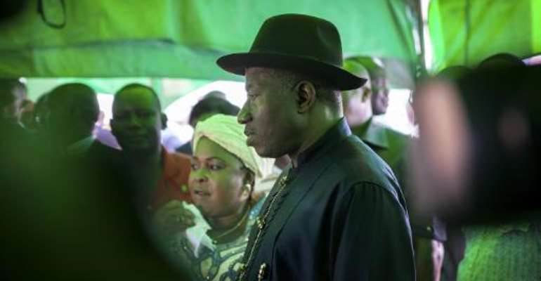 Nigerian president Goodluck Jonathan arrives to cast his ballot during presidential elections at a polling station in Otuoke on March 28, 2015. By Florian Plaucheur (AFP/File)