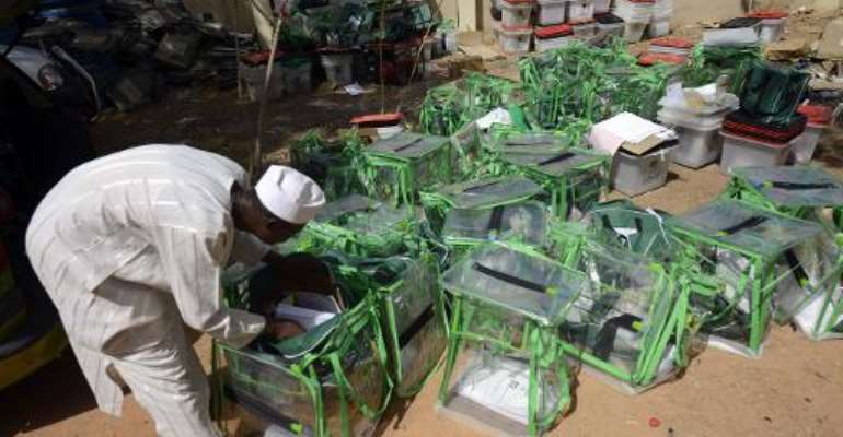 An election official empties ballot boxes in Katsina State on March 29, 2015 following the presidential election. By Pius Utomi Ekpei (AFP)