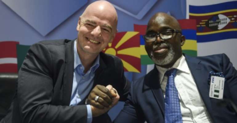 Nigerian football boss Amaju Pinnick (R) with FIFA president Gianni Infantino.. By PIUS UTOMI EKPEI (AFP)