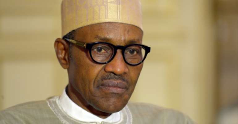 Nigerian President Muhammadu Buhari presented a record 8.6 trillion naira budget to the National Assembly to support the country's economic recovery. By Bertrand GUAY (AFP/File)