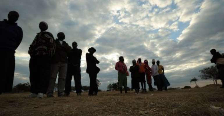 Zimbabweans prepare to cast their ballots at a polling station in Domboshava on July 31, 2013. By Alexander Joe (AFP/File)