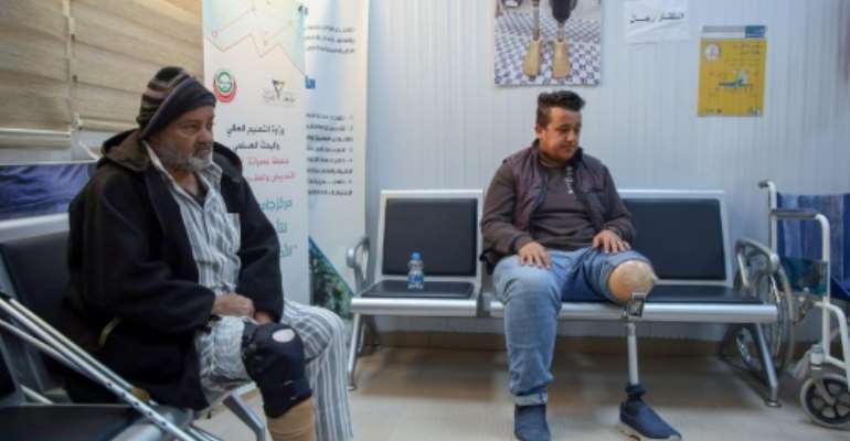 Patients wait for a consultation at a centre for artificial limbs in the Libyan port city of Misrata. By Mahmud TURKIA (AFP)