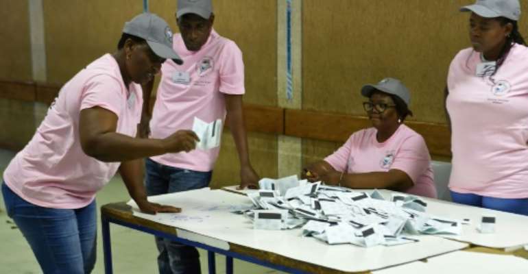 Polling officers verify ballots at a counting centre in the Ledumang Senior Secondary school for the Gaborone North constituency, in Gaborone on October 23, 2019. By Monirul Bhuiyan (AFP/File)