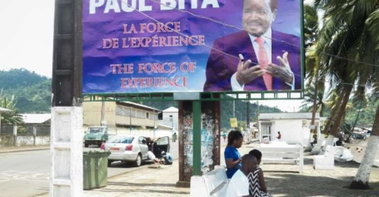 Posters tout Biya as a time tested leader. By STRINGER (AFP/File)