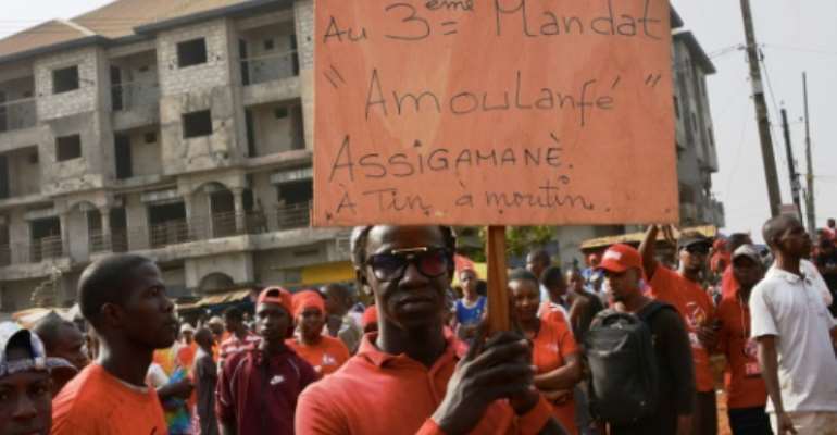 Protest: A man holds up a placard reading 'No to the 3rd term' in an anti-Conde rally in January. By CELLOU BINANI (AFP/File)