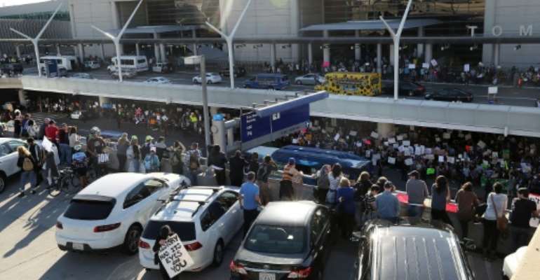 Protesters gather at the Los Angeles International Airport in January 2017 after US President Donald Trump restricts visits by citizens of several Muslim-majority nations. By JUSTIN SULLIVAN (GETTY IMAGES NORTH AMERICA/AFP/File)