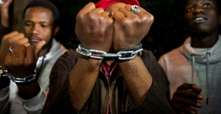 Protesters held demonstrations outside the Libyan embassy in Morocco demanding action over slave auctions in Libya. By FADEL SENNA (AFP/File)