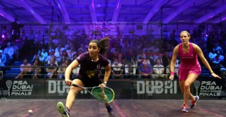 Raneem el-Welily of Egypt (L) plays a backhand to Laura Massaro of Great Britian in the final match of the Dubai PSA World Series Finals squash tournament in Dubai, May 28, 2016. By MARWAN NAAMANI (AFP/File)