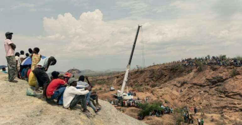 Rescue workers have been draining water from the mine shaft so that they can access trapped miners. By Jekesai NJIKIZANA (AFP)