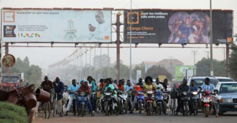Riding motorbikes and bicycles is very popular in Burkina Faso. By LUDOVIC MARIN (AFP/File)