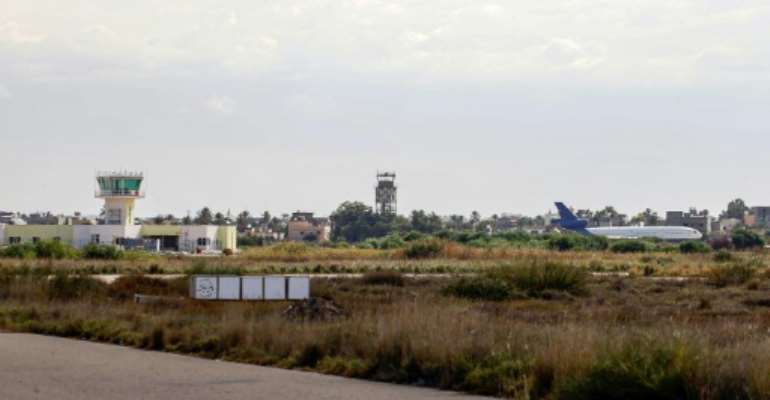 Libya airport suspends flights for hours after rocket fire