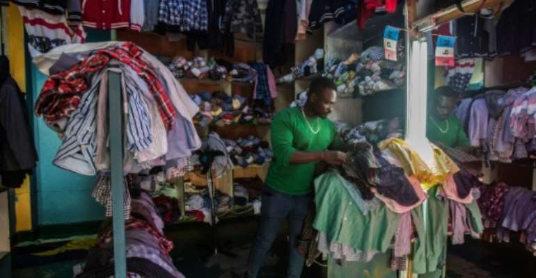 Rwanda blames used clothing -- which mainly comes from the US -- for undermining the development of its local textile industry. By Jacques NKINZINGABO (AFP/File)
