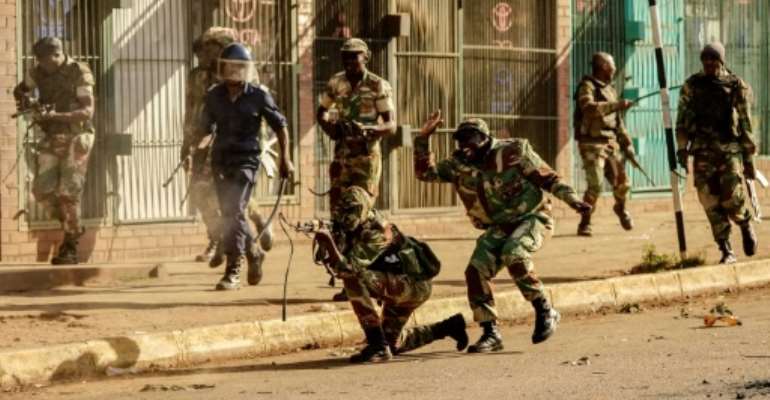 Soldiers fired live ammunition during opposition MDC party protests in downtown Harare, AFP witnesses saw, with one man shot dead in the stomach. By Zinyange AUNTONY (AFP)