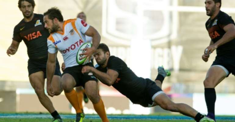 South Africa's Cheetahs fly-half Ruan Van Rensburg (2nd L) is tackled by Argentina's Jaguares wing Ramiro Moyano during their Super Rugby match, at Jose Amalfitani stadium in Buenos Aires, on March 18, 2017. By Alejandro Pagni (AFP)