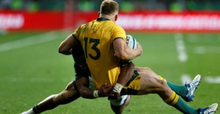 South Africa's defence withstood a second-half barrage from Reece Hodge and Australia. By GIANLUIGI GUERCIA (AFP)