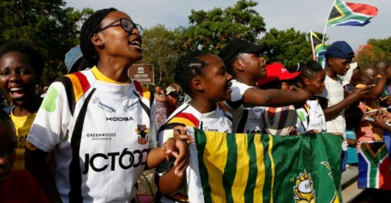 Soweto Rugby School Academy's girl players await the return of their Springbok heroes after winning the World Cup. By Phill Magakoe (AFP)