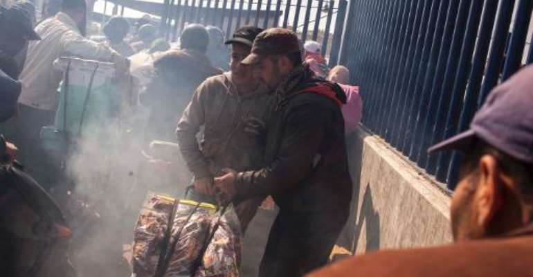 People queue at the Beni Anzar border between Morocco and Spain's North African enclave of Melilla in Beni Anzar on March 22, 2014. By Jose Colon (AFP/File)