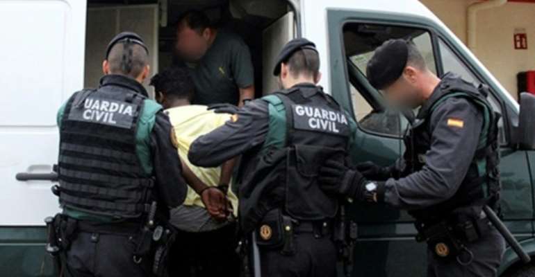 Spanish civil guards arresting an unidentified man in Ceuta, an overseas territory located in northern Morocco which attracts hordes of Europe-bound migrants. By Handout (Spanish Guardia Civil/AFP/File)