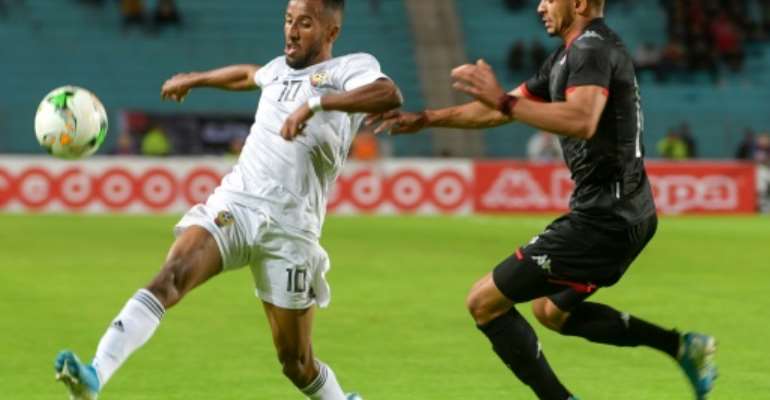 Star Libya forward Hamdou Elhouni (L) in action against Tunisia during a 2021 Africa Cup of Nations qualifier. By Fethi Belaid (AFP)
