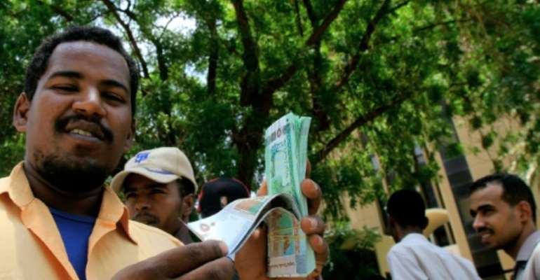 Sudan has devalued its currency three times this year in the face of an economic crisis. By ASHRAF SHAZLY (AFP/File)