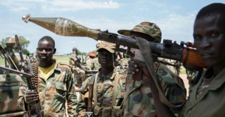 Sudan People's Liberation Army (SPLA) forces guard a checkpoint in Alole, on October 16, 2016. By Charles Atiki Lomodong (AFP)
